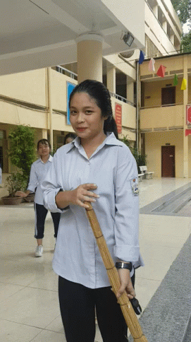Girl Holding Broom with A Sign