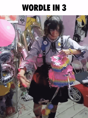 Girl Holding Pinata in Front of Balloons Wordle in 3