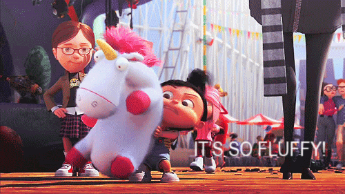 Girl Holding Stuffed Unicorn It's So Fluffy