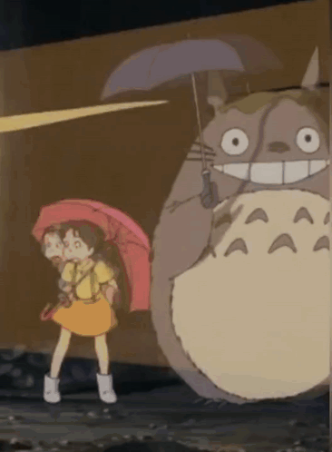 Girl Holding Umbrella Next to Totoro in Rain