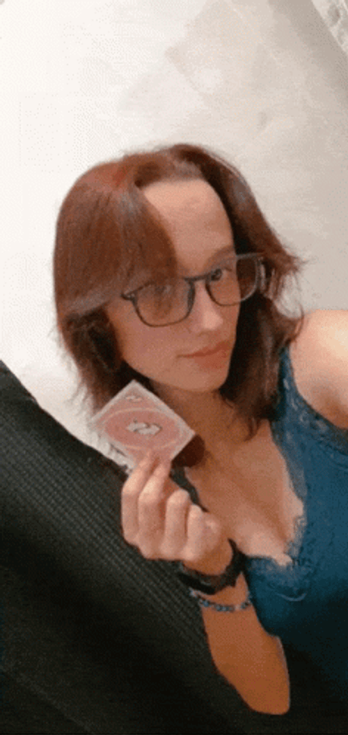 Girl Holding Uno Reverse Card GIF