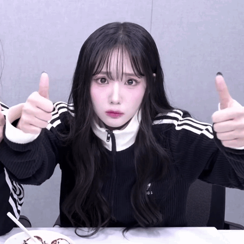 Girl in Black Adidas Sweater Giving Thumbs Up