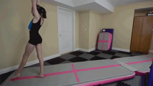Girl in Black Leotard Doing Trick