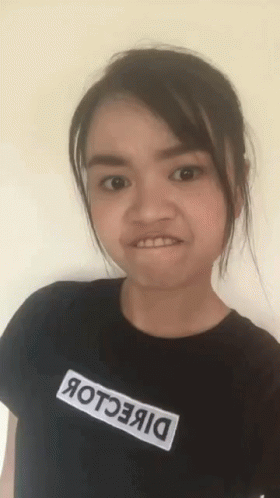 Girl in Black Shirt Saying Direction