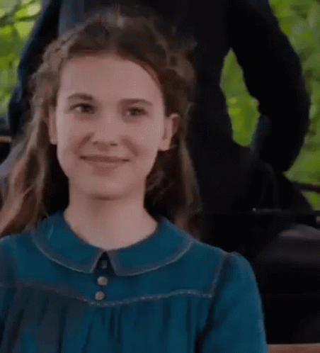 Girl in Blue Dress Smiling Close Up