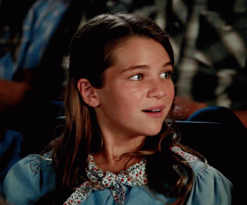 Girl in Blue Dress with Floral Collar