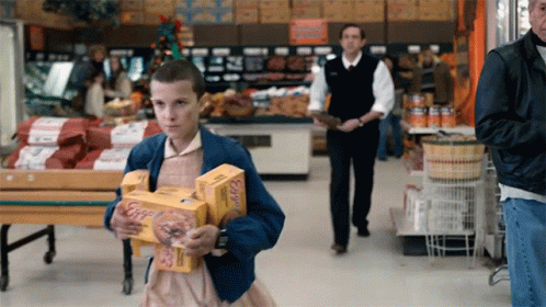 Girl in Blue Jacket Carrying Boxes of Eggs