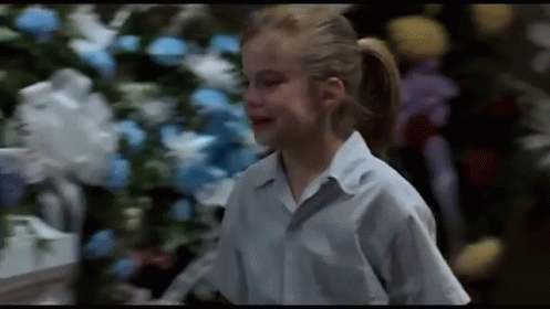 Girl in Blue Shirt with Christmas Tree