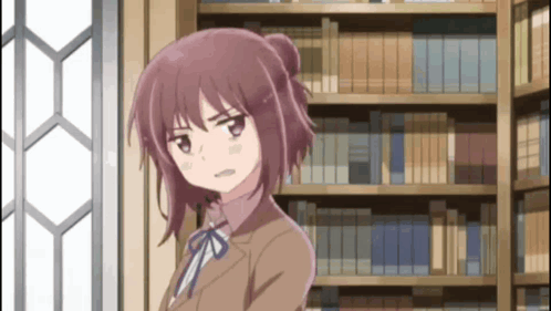 Girl in Brown Suit in Front of Bookcase