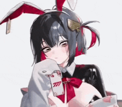 Girl in Bunny Costume Holding Playing Card