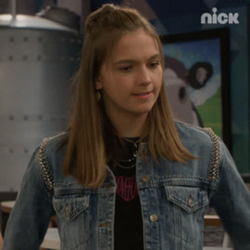 Girl In Denim Jacket And Pink Heart Shirt GIF