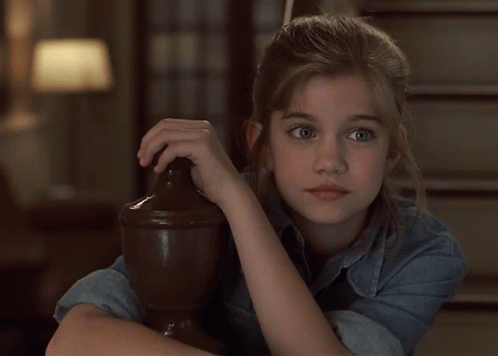 Girl In Denim Shirt Leaning On Wooden Pillar GIF