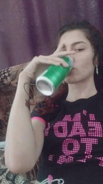Girl in 'Eeep' Shirt Drinking From Green Can
