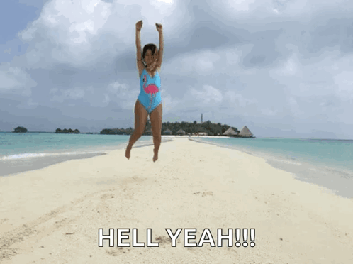 Girl in Flamingo Swimsuit Jumping Beach
