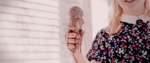 Girl in Floral Dress Holding Ice Cream Cone