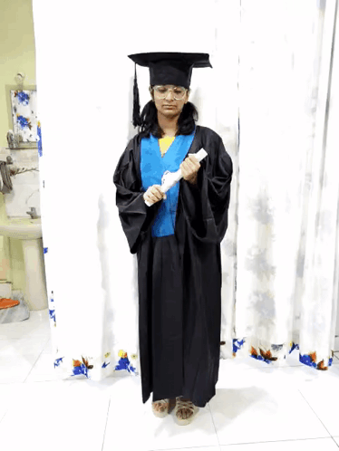 Girl in Graduation Cap and Gown