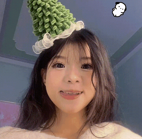 Girl in Green Hat with White Ruffle