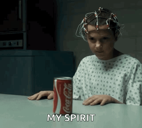 Girl in Hospital Gown Sitting with Coca Cola