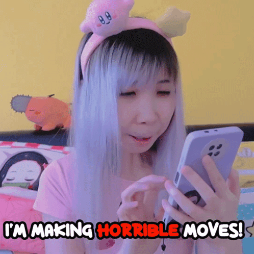 Girl in Kirby Headband Looking at Phone Saying I'm Making Horrible Moves