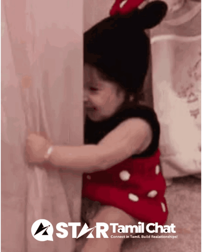 Girl in Minnie Mouse Outfit Behind Wall