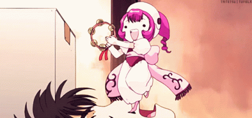 Girl In Pink And White Holding Tambourine GIF