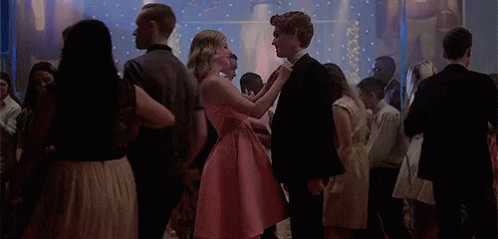 Girl in Pink Dress Dancing with Boy in Black Suit