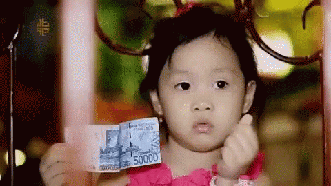 Girl in Pink Dress Holding 50000 Bill