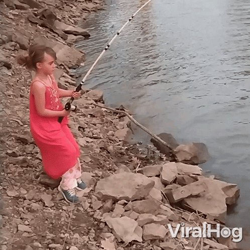 Girl in Pink Dress Holding Fishing Rod