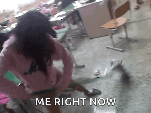 Girl In Pink Shirt Standing In Classroom Saying Me Right Now GIF