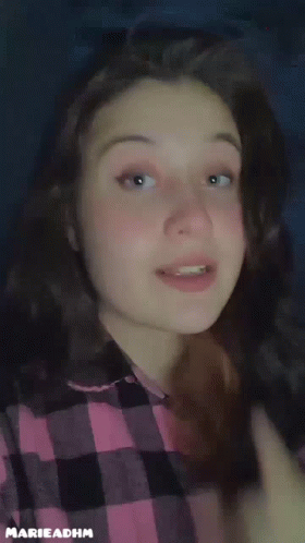 Girl in Plaid Shirt Saying Eat Rice