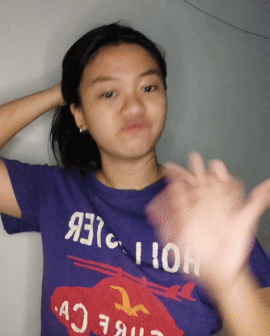Girl in Purple Hollister T-Shirt Making Funny Face