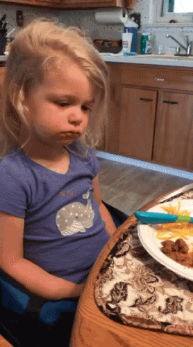 Girl In Purple Whale Shirt At Table GIF