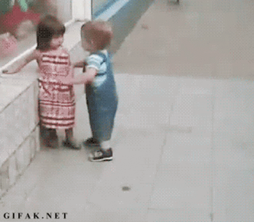 Girl In Red Dress And Boy In Blue Overalls GIF