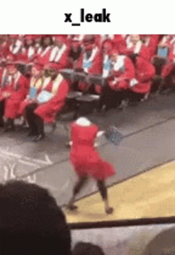 Girl in Red Dress Dancing at Graduation