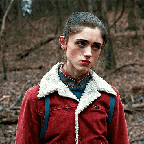 Girl in Red Jacket With Sherpa Collar and Plaid Shirt