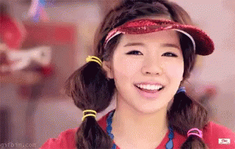 Girl In Red Shirt And Red Hat Smiling GIF