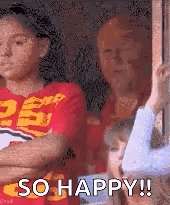 Girl in Red Shirt Arms Crossed So Happy