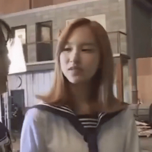 Girl In Sailor Suit Next To Man GIF