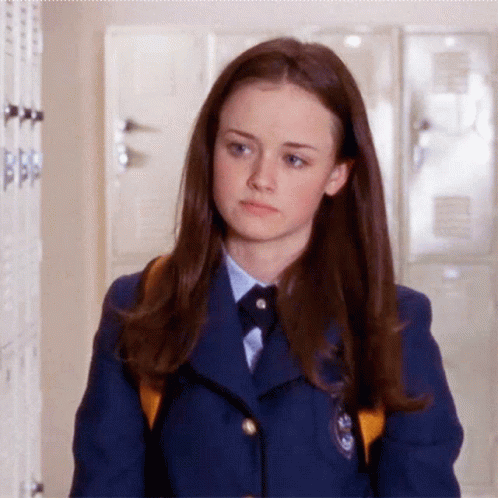 Girl in School Uniform Walking Hallway