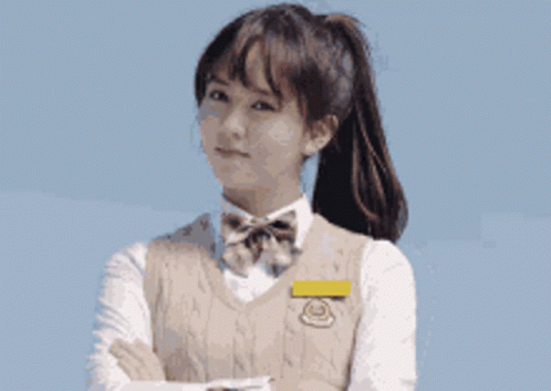 Girl in School Uniform With Arms Crossed