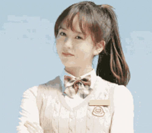 Girl in School Uniform with Ponytail and Bow Tie