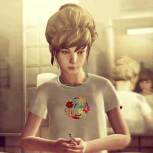 Girl in Smiley Shirt Looking at Phone