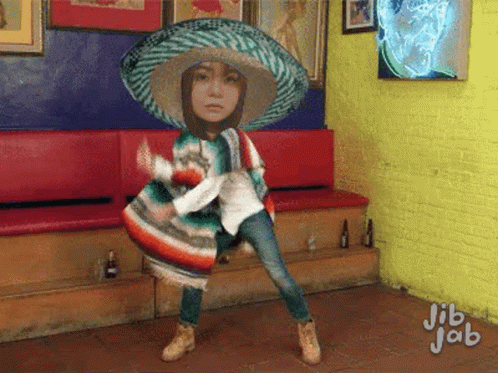 Girl in Sombrero and Poncho Dancing