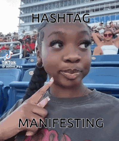 Girl in Stadium With Hashtag Manifesting