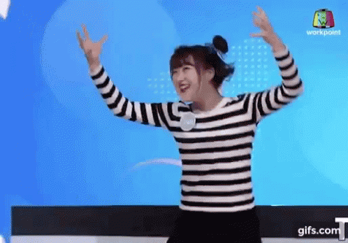 Girl In Striped Shirt Dancing With Arms Outstretched GIF