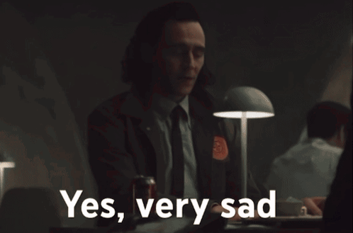 Girl In Suit Peeking Out Door Saying So Anyway GIF