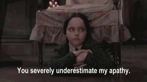 Girl in Suit Sitting With You Severely Underestimate My Apathy Text
