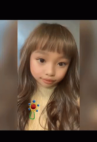 Girl in Sweater With Flower Brooch