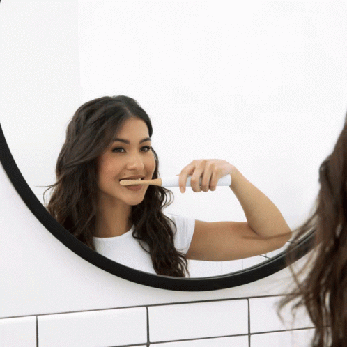 Girl In The Mirror Brushing Teeth GIF