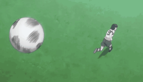 Girl in White Shirt Looking at Soccer Ball